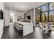 Contemporary kitchen featuring an island with bar stools, modern lighting, and a breakfast nook with outside views at 3184 Wood Valley Nw Rd, Atlanta, GA 30327
