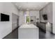 Spacious kitchen featuring a large center island, stainless steel appliances, and sleek cabinetry at 3184 Wood Valley Nw Rd, Atlanta, GA 30327