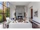 Spacious living room with dark hardwood floors, elegant furniture, and a floor to ceiling fireplace at 3184 Wood Valley Nw Rd, Atlanta, GA 30327