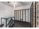 Elegant wine room features custom wine racks, a modern table, and a unique ceiling design at 3184 Wood Valley Nw Rd, Atlanta, GA 30327