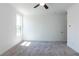 A well-lit bedroom showcasing neutral walls and plush gray carpeting at 344 Olmstead Way # 32, Alpharetta, GA 30022