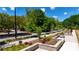 Beautifully landscaped courtyard with benches and tables, offering a relaxing outdoor space at 344 Olmstead Way # 32, Alpharetta, GA 30022