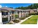 New construction townhomes with modern exteriors, balconies, and well-manicured landscaping at 344 Olmstead Way # 32, Alpharetta, GA 30022