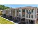 Charming new construction townhomes featuring a mix of brick, siding, and private balconies at 344 Olmstead Way # 32, Alpharetta, GA 30022