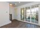 Bright living area with modern flooring and sliding doors to covered patio at 344 Olmstead Way # 32, Alpharetta, GA 30022
