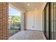 Covered patio with brick flooring, pillars, and a view of the fenced backyard at 344 Olmstead Way # 32, Alpharetta, GA 30022