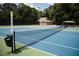 Outdoor tennis court surrounded by mature trees with a nearby shade pavilion at 348 Olmstead Way # 30, Alpharetta, GA 30022