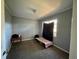 Modest bedroom with neutral walls, carpeted flooring, and natural light from the window at 300 Flagstone Way, Austell, GA 30168
