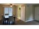 Inviting dining area with a ceiling fan, wood floors, and a view of the outdoors at 300 Flagstone Way, Austell, GA 30168