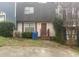 Charming two-story home featuring a cozy front porch and a well-maintained, compact front yard at 300 Flagstone Way, Austell, GA 30168