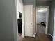 Hallway view with carpeted flooring, showcasing access to multiple rooms at 300 Flagstone Way, Austell, GA 30168