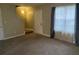 Comfortable living room with large windows, neutral walls, and carpeting at 300 Flagstone Way, Austell, GA 30168
