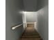 Carpeted staircase leading to the upper level, with handrail and neutral wall colors at 300 Flagstone Way, Austell, GA 30168