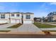 Charming townhome featuring a two-car garage, well-manicured lawn, and contemporary architectural design in a vibrant community at 200 Sanctuary Dr, Mcdonough, GA 30253