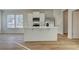 Well-lit kitchen with stainless steel appliances, a center island, and ample storage, designed for both functionality and style at 200 Sanctuary Dr, Mcdonough, GA 30253