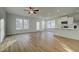 Bright open-concept living area featuring hardwood floors, recessed lighting, and modern fixtures, perfect for entertaining at 200 Sanctuary Dr, Mcdonough, GA 30253