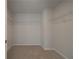 Walk-in closet with carpet and wire shelving to maximize storage space at 200 Sanctuary Dr, Mcdonough, GA 30253