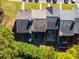 Aerial view of townhome roofs with patios and green space at 3971 Wolcott Cir # 3971, Atlanta, GA 30340