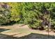 Landscaped backyard with mature trees providing ample privacy and shade at 3971 Wolcott Cir # 3971, Atlanta, GA 30340