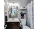 Full bathroom with decorated mirror, toilet, sink, and shower/tub combo at 3971 Wolcott Cir # 3971, Atlanta, GA 30340