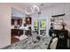 Dining area with modern light fixture, seating and view to the kitchen and outdoor patio at 3971 Wolcott Cir # 3971, Atlanta, GA 30340