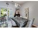 Cozy dining room featuring a modern chandelier and access to the outdoor patio at 3971 Wolcott Cir # 3971, Atlanta, GA 30340