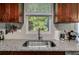 Close-up of kitchen sink and counter area with nice countertops, lighting, and hardware at 3971 Wolcott Cir # 3971, Atlanta, GA 30340