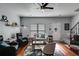 Cozy living room with hardwood floors, ceiling fan, and comfortable seating arrangement at 3971 Wolcott Cir # 3971, Atlanta, GA 30340