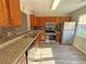 This kitchen features stainless steel appliances, wood cabinets, and laminate countertops at 3589 Main Station Sw Dr, Marietta, GA 30008