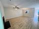 Open-concept living room with wood-look flooring and view into the kitchen at 3589 Main Station Sw Dr, Marietta, GA 30008