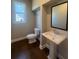 Cozy half bath featuring a pedestal sink at 273 Lakeside Pl, Canton, GA 30114