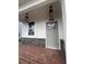 Charming front porch with brick flooring and stylish hanging lanterns at 273 Lakeside Pl, Canton, GA 30114