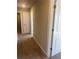Carpeted hallway leading to various rooms within the house at 273 Lakeside Pl, Canton, GA 30114