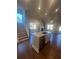 Kitchen island featuring granite countertops and stainless steel dishwasher at 273 Lakeside Pl, Canton, GA 30114