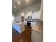 Modern kitchen with granite countertops, stainless steel appliances, and white cabinetry at 273 Lakeside Pl, Canton, GA 30114
