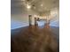 Open-concept living room, kitchen with hardwood floors and great natural light at 273 Lakeside Pl, Canton, GA 30114