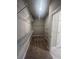 Walk-in closet featuring wire shelving and carpeted floors at 273 Lakeside Pl, Canton, GA 30114