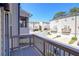 A serene balcony view overlooking a neighborhood with well-maintained townhomes and lush trees under a clear sky at 1813 Hislop Ln, Atlanta, GA 30345
