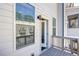 A relaxing balcony featuring a wooden deck and a view of the neighborhood's architecture and greenery at 1813 Hislop Ln, Atlanta, GA 30345