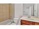 Bathroom features a tub/shower combo and a vanity with wood cabinetry and solid surface countertop at 1813 Hislop Ln, Atlanta, GA 30345