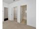 Bedroom featuring carpet and doors to closet, bedroom, and bathroom at 1813 Hislop Ln, Atlanta, GA 30345