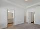 Bedroom featuring walk-in closet, en-suite bathroom, and a view to another bedroom at 1813 Hislop Ln, Atlanta, GA 30345