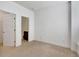 Bedroom with neutral carpet and white doors leading to closet and bathroom at 1813 Hislop Ln, Atlanta, GA 30345