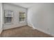 Bedroom with carpet, two windows with wood blinds that provide natural light at 1813 Hislop Ln, Atlanta, GA 30345