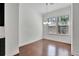 Bright dining area featuring hardwood floors, large windows, and modern lighting fixture at 1813 Hislop Ln, Atlanta, GA 30345