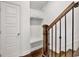 Entryway featuring coat rack, built-in seating and hardwood staircase at 1813 Hislop Ln, Atlanta, GA 30345