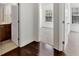 Bright hallway leads to a bathroom with granite counters and to a bedroom with natural light at 1813 Hislop Ln, Atlanta, GA 30345