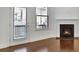 Living room with fireplace, hardwood floors, and walk-out porch at 1813 Hislop Ln, Atlanta, GA 30345