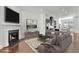 Staged living room with fireplace and kitchen view at 1813 Hislop Ln, Atlanta, GA 30345