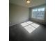 Bright bedroom with large window offering plenty of natural light at 277 Lakeside Pl, Canton, GA 30114